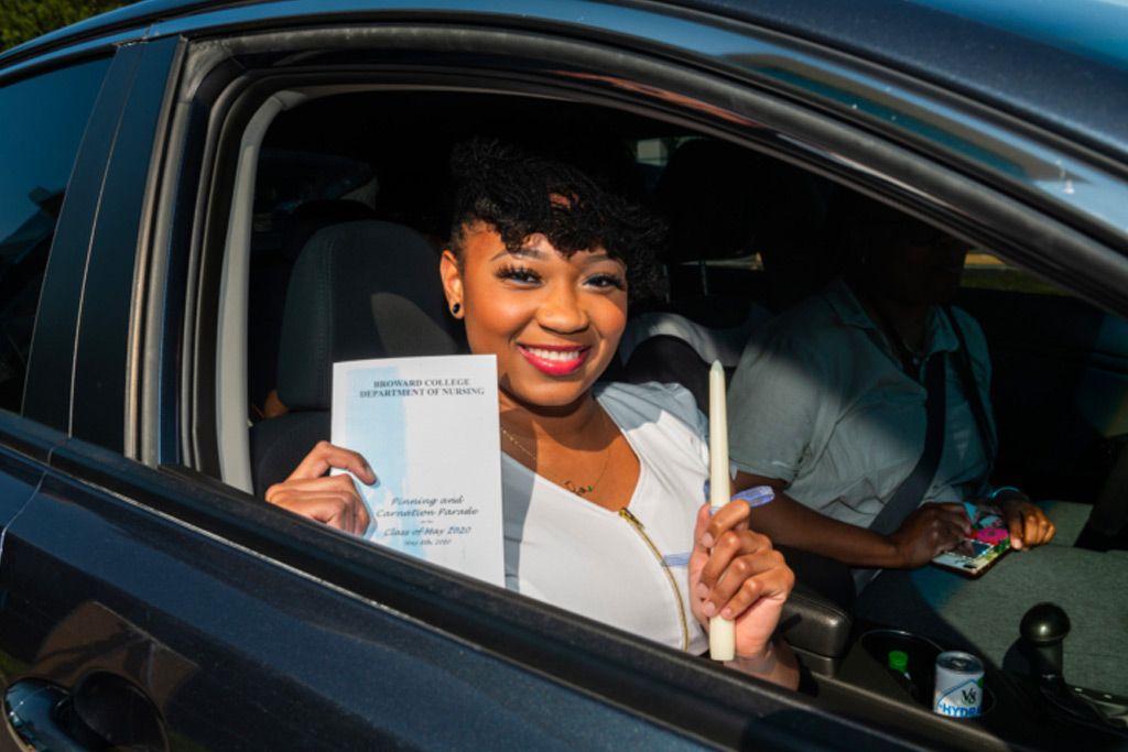 Photo of nursing grad at drive-through ceremony