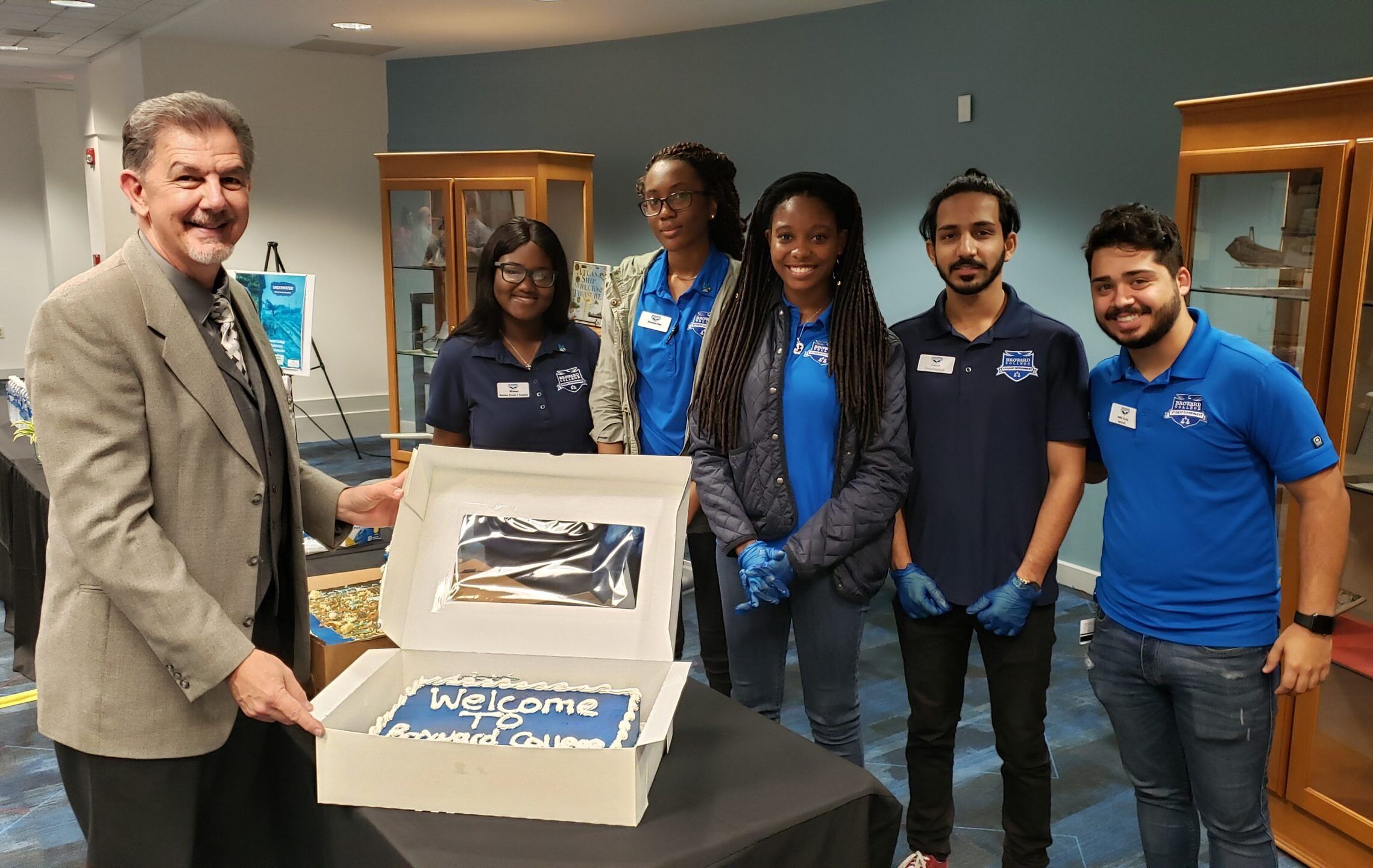 Students gather with leadership inside of library