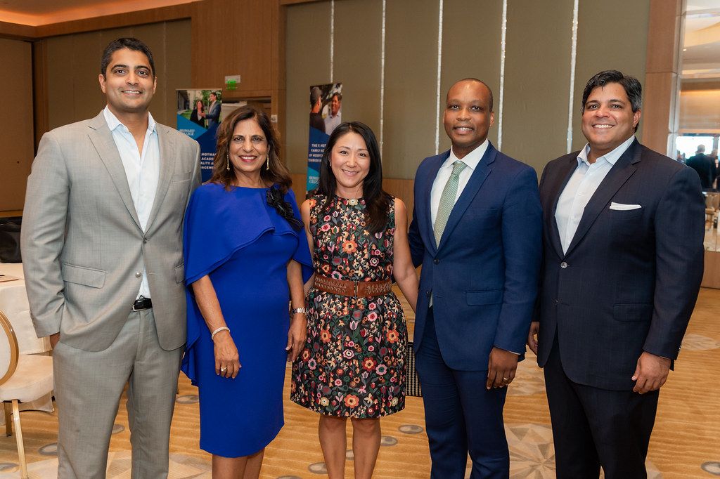 Photo of President Hail and wife with the Motwani Family