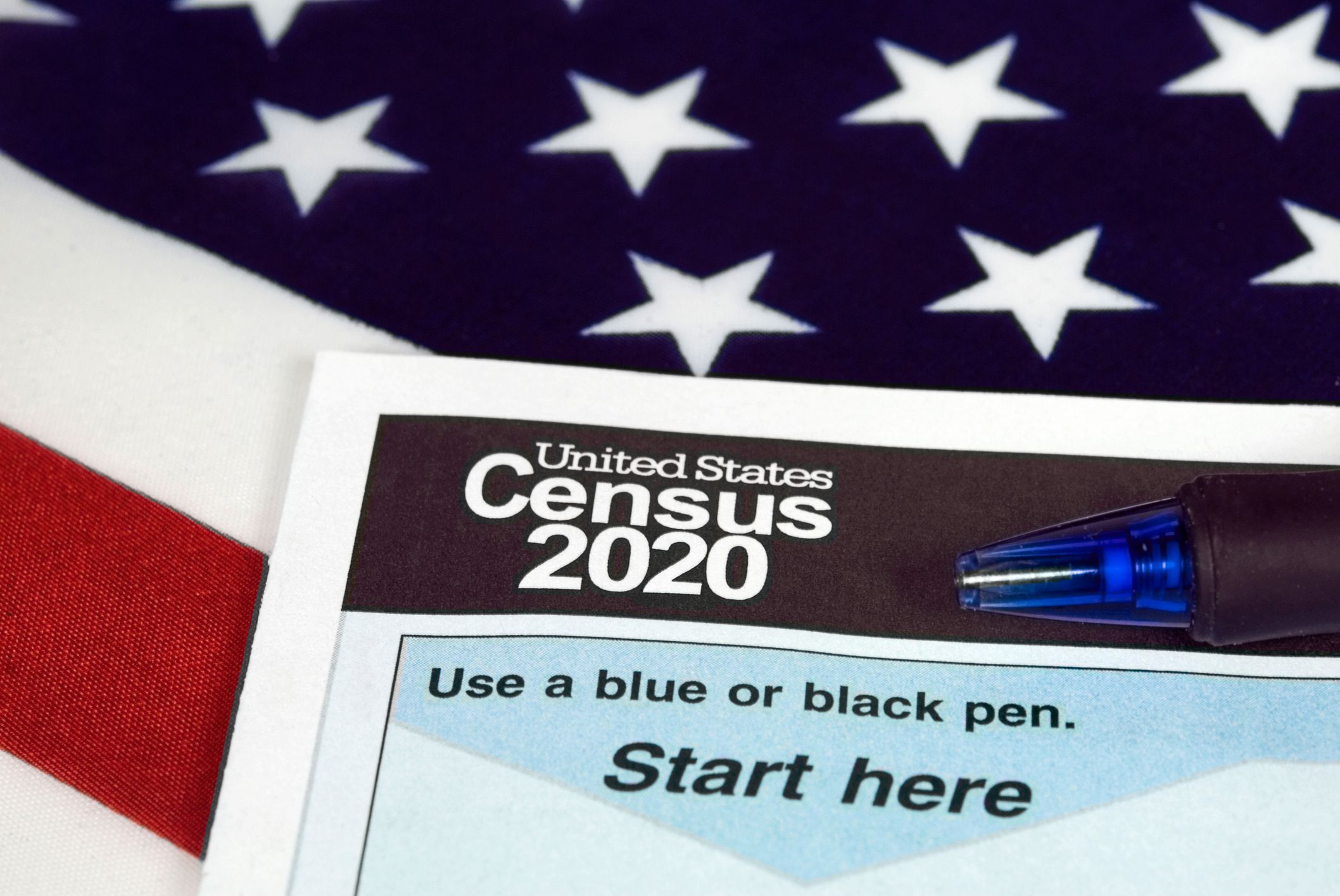 census form on top of american flag