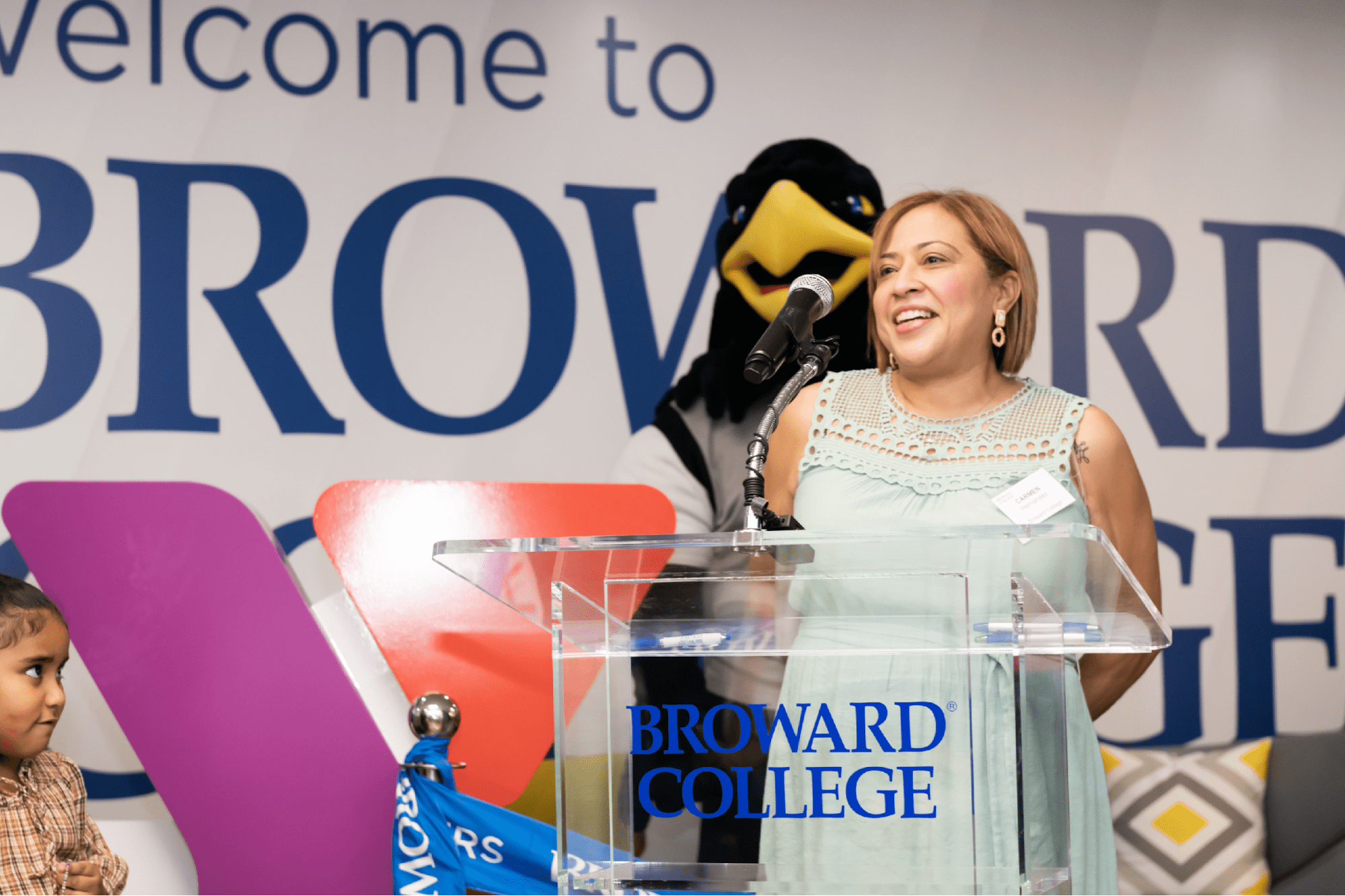 Mother of five found a job and is on track to complete her G.E.D. through College's program at L.A. Lee YMCA/Mizell Community Center on historic Sistrunk Boulevard speaks to a grand opening audience.